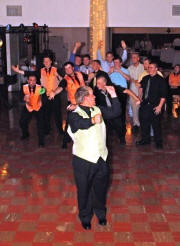 DJWOZ.com Groom throwing Garter
